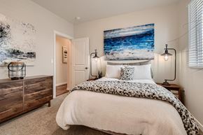 Colorado Springs apartment for rent - a bedroom with a bed and a painting on the wall