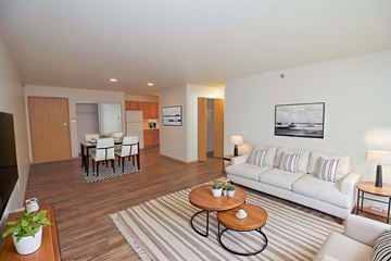 Fargo apartment for rent - A living room with a white couch and a coffee table.