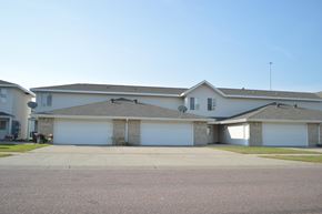 Fargo apartment for rent - A house with a grey roof and a garage door.