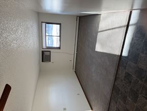 Bismarck apartment for rent - A room with a window and a tiled wall.