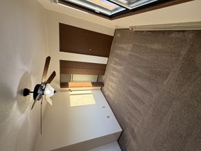 Bismarck apartment for rent - A ceiling fan is mounted on a wall in a room with a skylight.