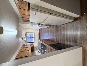 Bismarck apartment for rent - A kitchen with a stove top oven and a window.