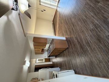 Bismarck apartment for rent - A small kitchen with a microwave and a washing machine.