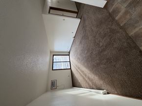 Bismarck apartment for rent - A room with a window and a brown wall.