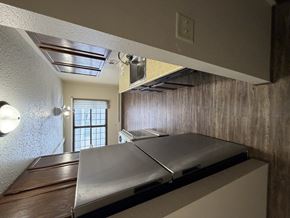 Bismarck apartment for rent - A stainless steel countertop in a room with a window.