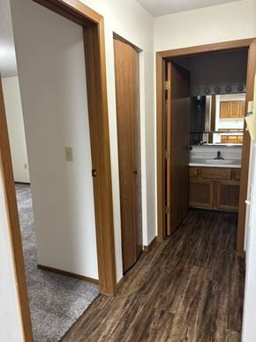 West Fargo apartment for rent - A bathroom with a sink and mirror.