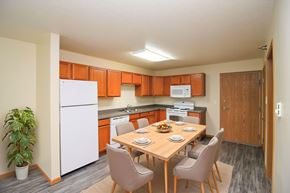 Fargo apartment for rent - A kitchen with a table set for four.