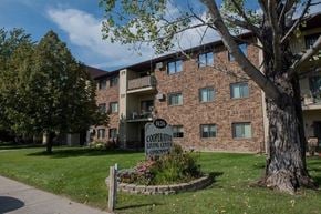 West Fargo apartment for rent - A brick building with a sign that says "Cooperative Living Center".