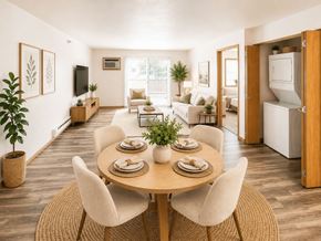 Fargo apartment for rent - A dining room with a round table surrounded by chairs.