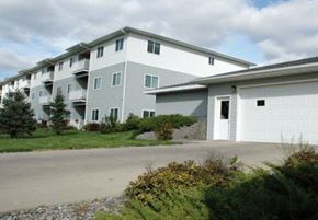 Aberdeen apartment for rent - Apartment building with a grey and white exterior and a garage door.