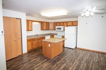 Aberdeen apartment for rent - A kitchen with wooden floors and white appliances.