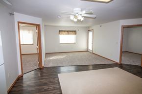 Aberdeen apartment for rent - A room with a ceiling fan and a rug on the floor.