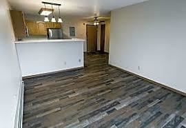 Bismarck apartment for rent - A kitchen area with a white counter and a wood floor.