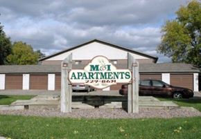 Aberdeen apartment for rent - A sign for M&I Apartments stands in front of a building.