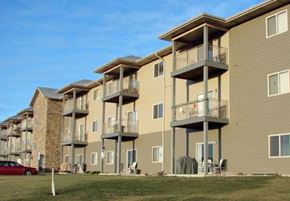 Aberdeen apartment for rent - Apartment complex with a red car parked in front.