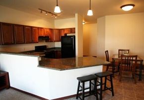 Aberdeen apartment for rent - A kitchen with a bar area and a dining table.