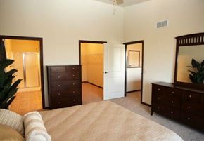 Aberdeen apartment for rent - A bedroom with a bed, dresser, and mirror.