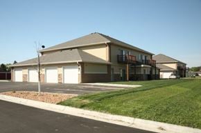 Aberdeen apartment for rent - A building with a brown roof and white garage doors.