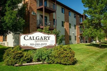 Bismarck apartment for rent - A Calgary apartments sign in front of a building.