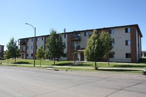 Bismarck apartment for rent - Apartment building with a tree in front of it.
