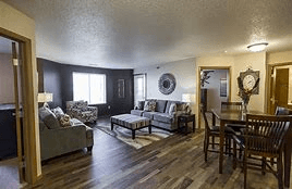 Bismarck apartment for rent - A living room with a couch, chair, and table.