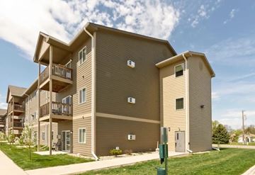 Aberdeen apartment for rent - A large apartment building with multiple balconies and doors.