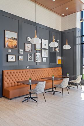 Minnetonka apartment for rent - a table and chairs in a room with a couch and pictures on the wall