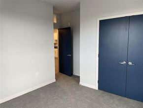 St. Paul apartment for rent - a bedroom with a blue door and a white wall