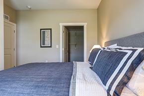 Wyoming apartment for rent - A bedroom with a bed and a picture on the wall.