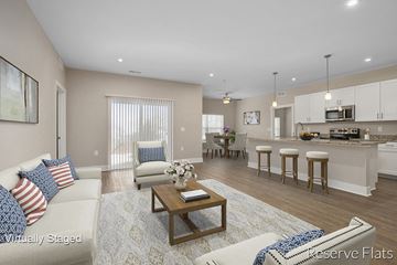 Wyoming apartment for rent - a living room and kitchen with a couch and a table