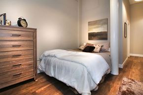 Boston apartment for rent - a bedroom with a bed and a dresser