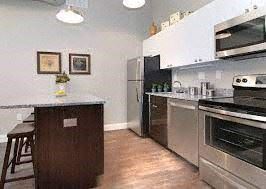 Boston apartment for rent - a kitchen with stainless steel appliances and a counter top