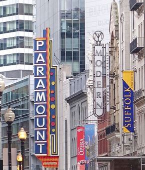Boston apartment for rent - a city street with tall buildings and signs