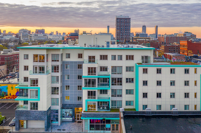 Cambridge apartment for rent - an aerial view of an apartment building with a city in the background