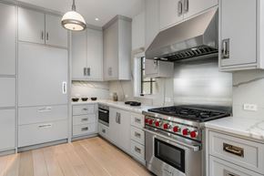 Pacific Palisades apartment for rent - A modern kitchen with a stainless steel stove and white cabinets.