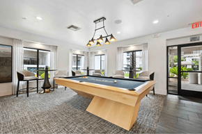 Scottsdale apartment for rent - A pool table is in the middle of a room with a chair and a lamp.