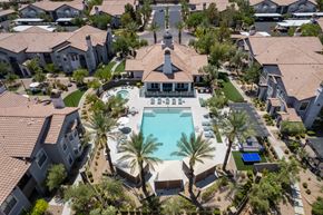 Henderson apartment for rent - an aerial view of a swimming pool surrounded by houses and palm trees