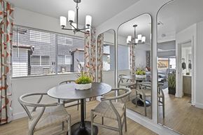 Henderson townhouse for rent - a dining area with a table and chairs and a large window