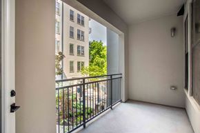 Nashville apartment for rent - a balcony with a view of a building and some trees