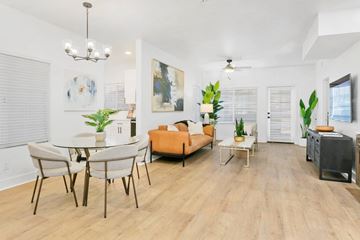 Scottsdale apartment for rent - A living room with a dining table and chairs.