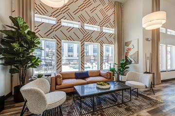 Colorado Springs apartment for rent - a living room with a couch and chairs and a coffee table
