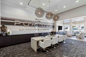 Centennial apartment for rent - a room with a long table and chairs in front of a sign that says the portola