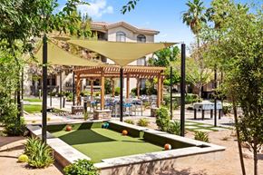 Tempe apartment for rent - A backyard with a pool table and a patio area.