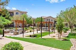 Tempe apartment for rent - A sunny day at a park with a playground and a building in the background.