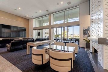 Phoenix apartment for rent - a living room with a fireplace and a table with chairs