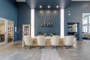 Phoenix apartment for rent - slate scottsdale leasing office with large table and chairs