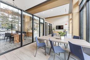 San Diego apartment for rent - a dining room with a wooden table and chairs