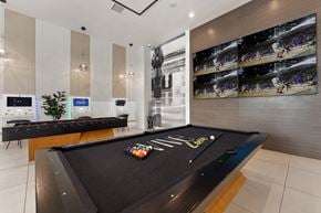 San Diego apartment for rent - a game room with a pool table and a large scoreboard