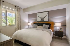 San Diego apartment for rent - a bedroom with a large bed and two night stands with lamps