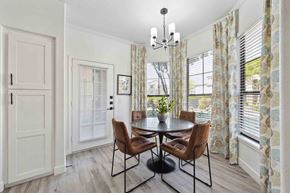 Glendale apartment for rent - a dining room with a round table with four chairs and a chandelier